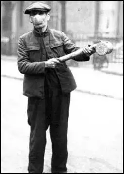 A man spraying the streetswith chemicals in 1918