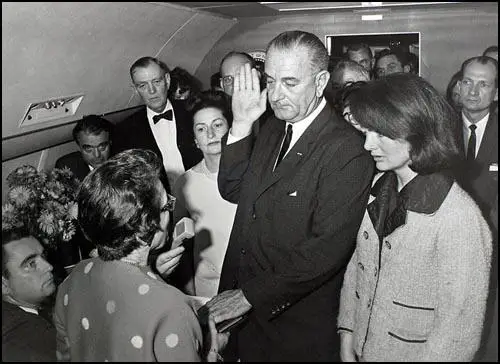 The swearing-in of President Lyndon Baines Johnson on Air Force One.