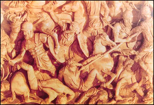 Sculptured relief of Roman soldiers fighting the barbarians.
