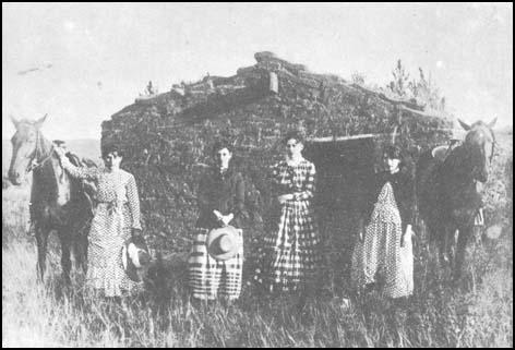 Family and their sod house in Nebraska.