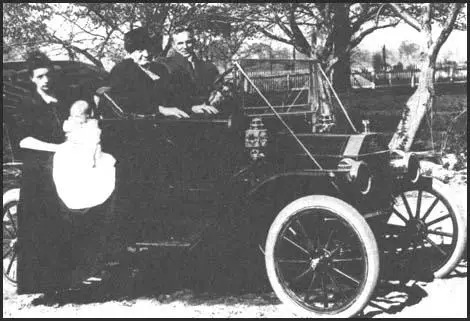 Henry Ford with his Model T car in 1912.