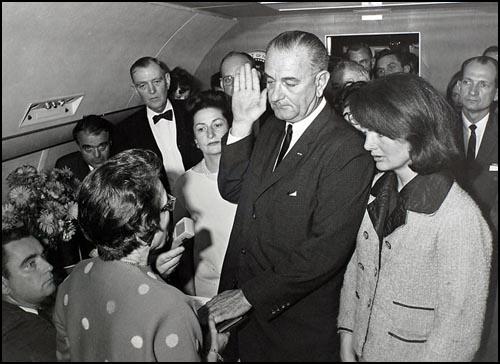 The swearing-in of President Lyndon Baines Johnson on Air Force One.