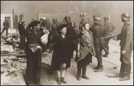 People in the Warsaw Ghetto surrendering (16th May, 1943)