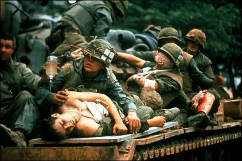 Wounded marines riding on a converted tank used as make-shift ambulence during the battle to recapture Hue during the Tet Offensive.