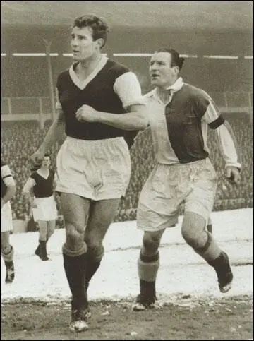 Malcolm Allison in action against Blackburn Rovers. West Ham are wearing the modern kit advocated by Allison whereas the opposition are wearing the traditional kit. (18th February, 1956)