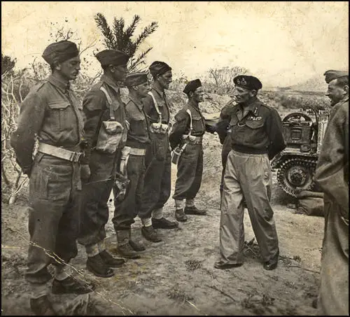 General Bernard Montgomery, the Commander of the Eighth Army, inspects troops in North Africa in 1942. Corporal Jack Hughes, Muriel Simkin's younger brother stands on the far left of the row of soldiers.
