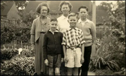 Back Row (left to right): Elizabeth Hughes (64) Mum (43) and John (12) Front Row: Gordon (a visitor) and David (8) in the back garden at Audley Gardens.