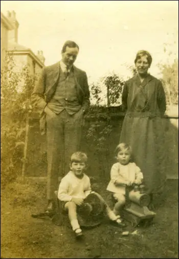 My grandparents and my father to be on the upside down wheelbarrow. (1923)