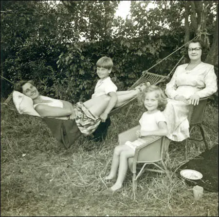 Mum in hammock, myself, with sister Fran and Nana in Lloyd Loom chairs. (1955)