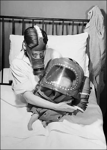 A mother and baby both in gas-masks (1941)