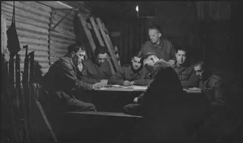 John Simkin and his team in a dug-out in between air-raids.