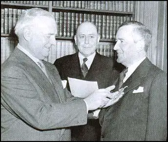 William Donovan pinning the Medal of Merit on William Stephenson
