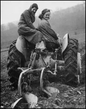 Women volunteers ploughing in winter.