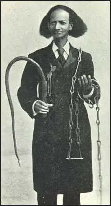Thomas Johnson withslave whip and chains.