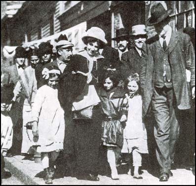 Elizabeth Gurley Flynn and Bill Haywood with children returning to Lawrence.