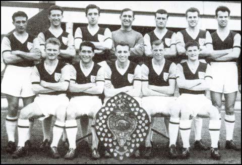 1958-59 team that won the Second Division league title. Back row, left to right: Andy Malcolm, Ken Brown, John Bond, Ernie Gregory, Noel Cantwell, Bill Lansdowne, Malcolm Pyke. Front row, Mike Grice, John Smith, Vic Keeble, John Dick, Malcolm Musgrove.