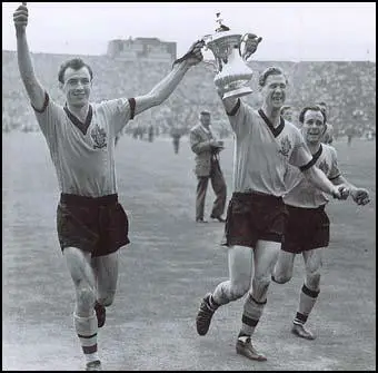 Eddie Clamp, Bill Slater and Norman Deeley celebrate the 1960 FA Cup win.